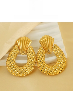 Macro shot of 18K gold plated geometric earrings with fine diamond-patterned grid texture