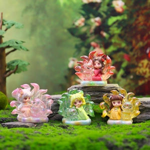 Macro view of four colorful Nine-Tailed Fox girl figurines in a mossy forest setting