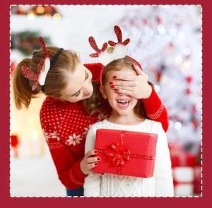 Close-up of woman and child wearing red reindeer antler headbands for Christmas celebration