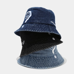Denim bucket hats with embroidered question marks in navy, black and light blue washed style