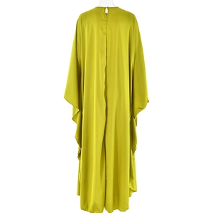 Detail view of the elegant lime green satin maxi dress showing the fluid back drape