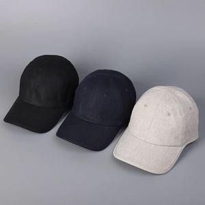 Three cotton linen baseball caps in black, navy, and beige with breathable texture