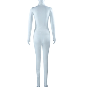 Detail view of the back of a white two-piece high-stretch yoga set with slim-fit long pants