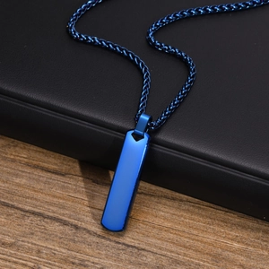 Macro view of a blue rectangular bar pendant on a stainless steel chain for men