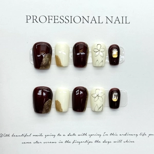 Handmade cream and burgundy press-on nails with floral art and rhinestones