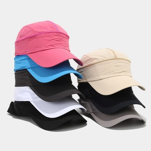 Stack of quick-dry sun hats in multiple colors including pink, blue, and beige