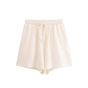 Women's cream white vacation set with textured lace-up top and elastic waist shorts