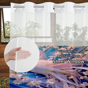 Detail showing sheer floral shower curtain with metal rings for light and privacy