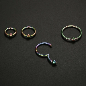 Rainbow stainless steel captive bead rings set with hinged segment closure for piercings