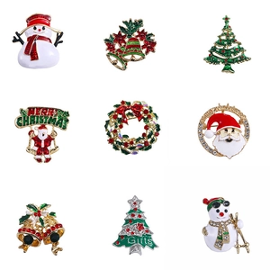 Set of nine vintage Christmas brooches with Santa, snowman and tree motifs
