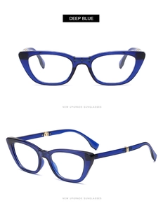 Detail view of deep blue cat eye sunglasses frame with elegant golden metal hinges