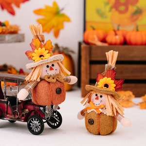 Harvest pumpkin scarecrow dolls with sunflowers and maple leaves for autumn decor