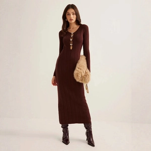 Detail of burgundy crochet slim-fit dress featuring an elegant hollow-out chest design