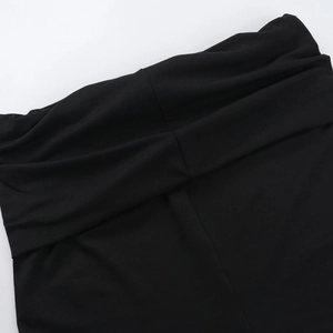 Close-up of black knitted fabric texture and elastic waistband detailing on casual set