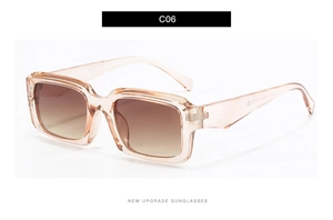 Detail view of square champagne frame sunglasses with gradient lenses and metal hinge