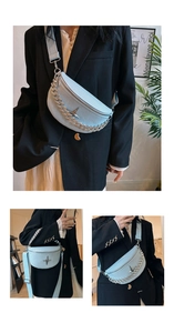 Detail of light blue textured leather chest bag with silver chain and star metal hardware