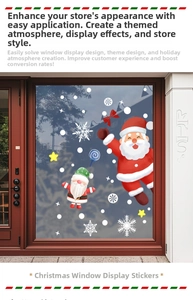 Detail of Christmas window stickers featuring Santa and elves on a glass storefront