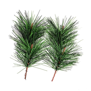 Detailed view of artificial green pine needle branches with realistic brown stems for DIY decor