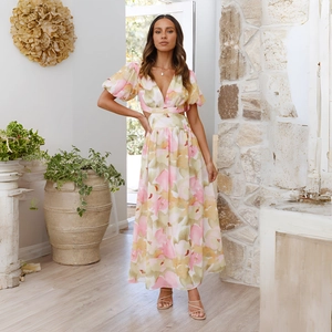 Detailed view of the deep V-neckline and cutout waist design on this floral maxi dress