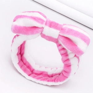 Soft pink and white striped coral fleece headband with a cute plush bow for SPA