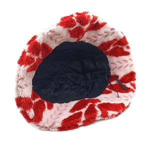 Detail of plush Christmas bucket hat showing black quilted lining and adjustable drawstring