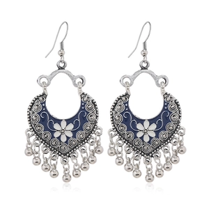 Bohemian silver hoop earrings with blue floral enamel patterns and small metal bell tassels