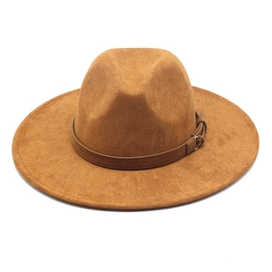 Vintage brown suede western cowboy fedora hat with a leather band and metal buckle detail
