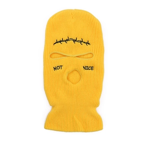Yellow 3-hole knitted balaclava ski mask with NOT NICE embroidery and mesh pattern