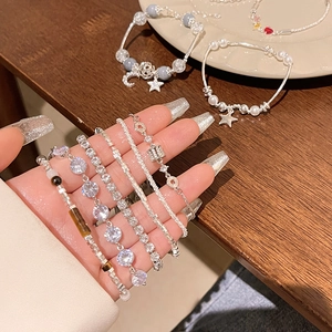 Elegant silver bracelets set with pearls, zircons, and star pendants for women