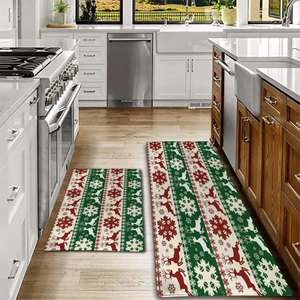 Close-up of Christmas kitchen mats set featuring reindeer and snowflake patterns