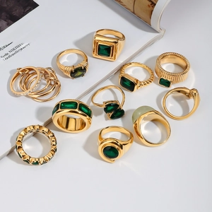 Luxurious 11-piece gold stainless steel ring set with emerald green stones and zircons