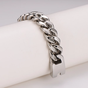 Polished silver cuban link chain bracelet for men in retro punk style on white display