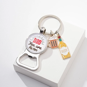 Detail of metal bottle opener keychain with Dad You are My Hero text and beer charms