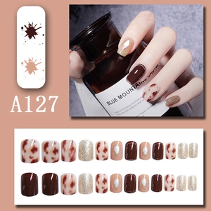Short square leopard print press-on nails set in brown tones with glitter accents