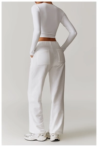Detailed back view of white high-waist sweatpants featuring two large square patch pockets