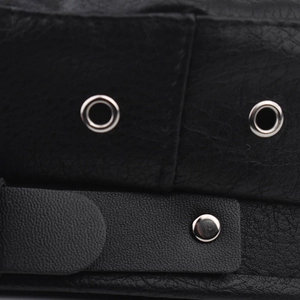 Macro detail of black PU leather baker boy hat with silver metal grommets and button