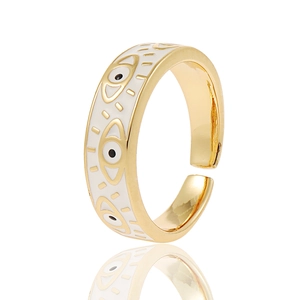 Detail of gold open ring with white enamel evil eye patterns and mirror reflection