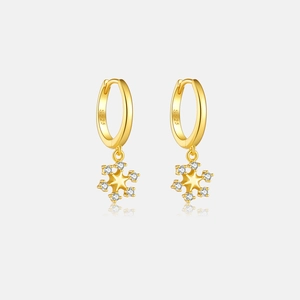 Detail of S925 sterling silver snowflake earrings with white zircon and gold finish
