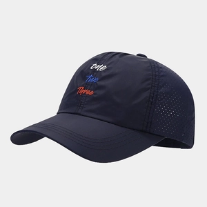 Detail of navy marathon cap showing laser-cut ventilation holes and multi-color embroidery