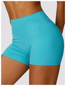 Détail du short de yoga turquoise taille haute avec coutures plates et effet push-up fessier