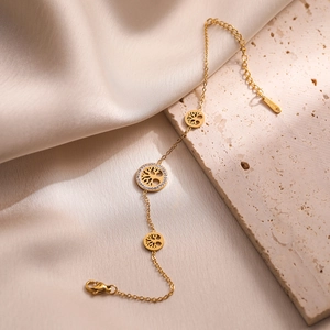 Gold-plated stainless steel Tree of Life bracelet with pavé crystal detail and lobster clasp