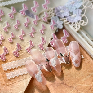 3D relief nail art stickers featuring pink bows and white lace ribbons on a vintage background