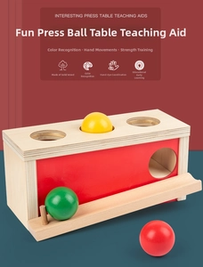 Wooden pounding ball set detail showing colorful balls and smooth solid wood finish