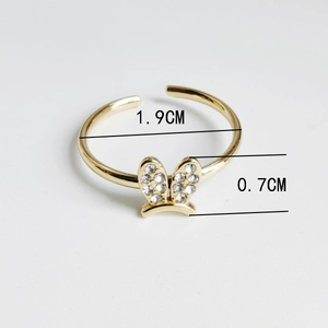 Macro detail of 18K gold plated rabbit ear ring showing dimensions 1.9cm and 0.7cm