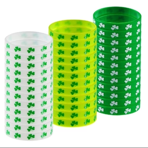 Detail view of silicone St. Patrick's Day wristbands with green clover patterns