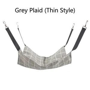 Detail view of a gray checkered cat hammock with adjustable straps and metal hooks