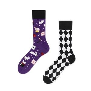 Creative mismatched mid-tube socks featuring purple magic theme and black white argyle pattern