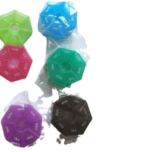 Portable 7-day pill organizer collection in various colors with weekday markings