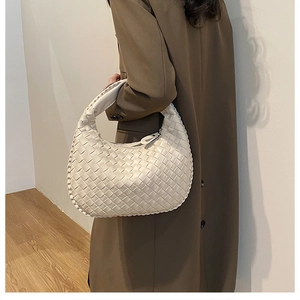 Detail shot of oversized woven hobo bag showing premium cross-weave PU texture