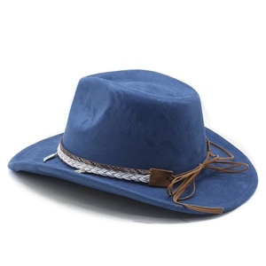 Detail of royal blue suede cowboy hat with braided band and silver feather pendant